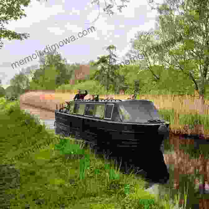 A Narrowboat Meandering Through A Tranquil Canal, Surrounded By Lush Greenery The Water Road: A Narrowboat Odyssey Through England